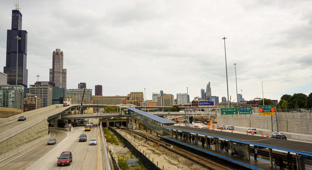 Chicago skyline with CTA train and highway in the foreground